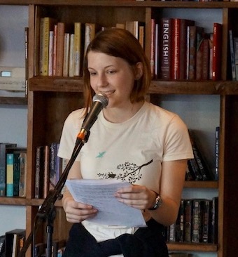 Roosevelt WITS student reading at Cathedral Coffee